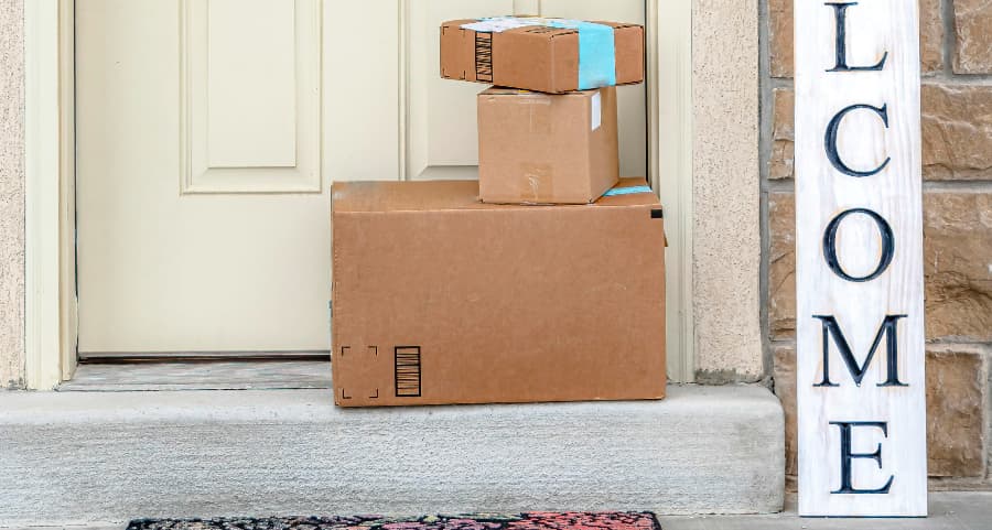 Deliveries on the front porch of a house with a welcome sign in Minneapolis